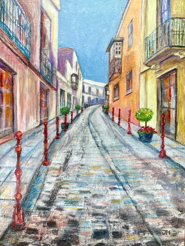 Quiet cobbled street in La Orotava town, Tenerife, with colourful yellow and cream buildings, red bollards and clipped topiary trees – acrylic painting by Joan Hudson